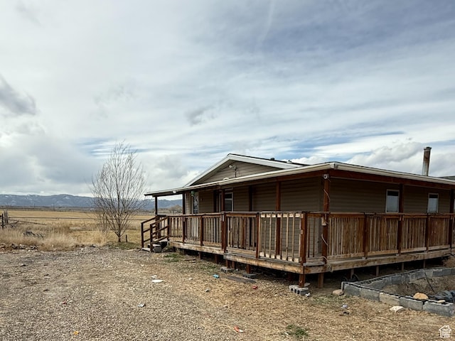 2445 N 260 W, Elmo, UT 84521 - view of side of property with covered porch and a mountain view