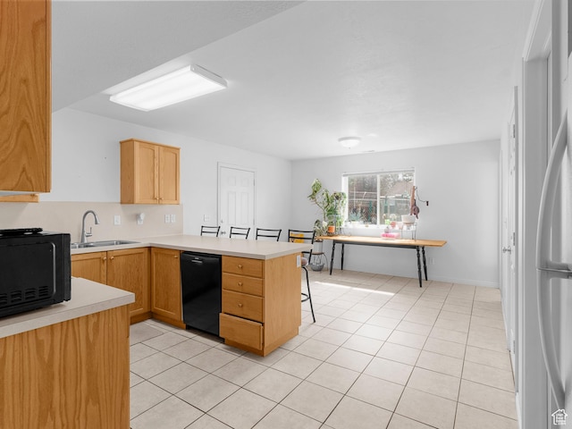 476 W 365 S, Logan, UT 84321 - kitchen with light countertops, a sink, a peninsula, light tile patterned floors, and black appliances