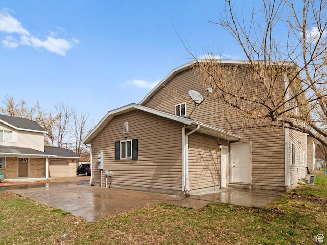 476 W 365 S, Logan, UT 84321 - back of property with a gambrel roof, cooling unit, and a patio