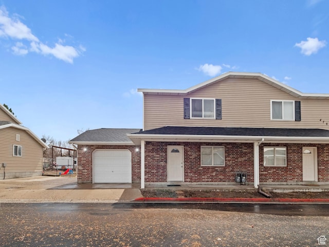476 W 365 S, Logan, UT 84321 - view of front of home with a shingled roof, a garage, concrete driveway, and brick siding