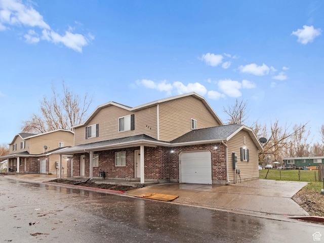 476 W 365 S, Logan, UT 84321 - traditional-style home featuring fence, a garage, brick siding, roof with shingles, and driveway