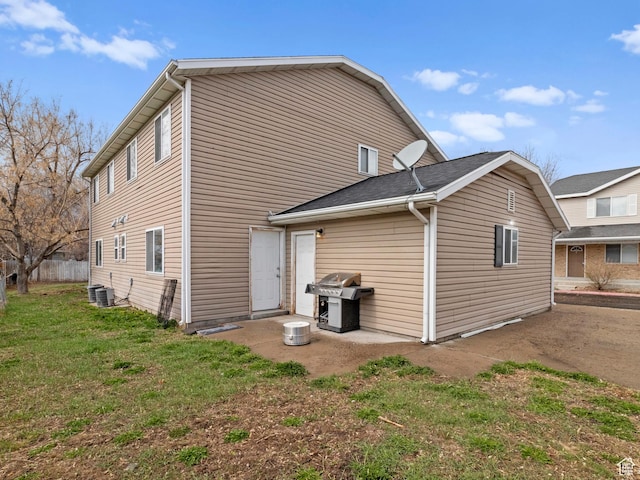 476 W 365 S, Logan, UT 84321 - back of property with a patio, central AC unit, and a lawn