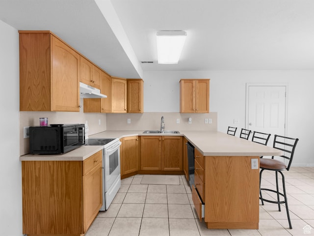 476 W 365 S, Logan, UT 84321 - kitchen featuring a sink, a breakfast bar area, a peninsula, under cabinet range hood, and black appliances