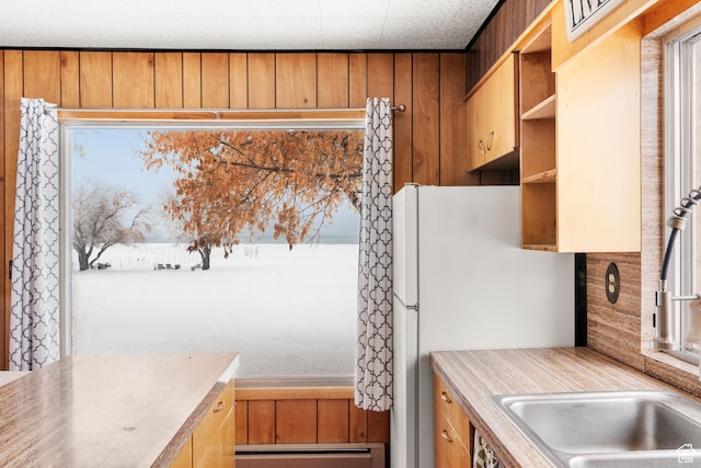 377 E Shore Rd, Saint Charles, ID 83272 - interior space with brown cabinets, baseboard heating, light countertops, and open shelves