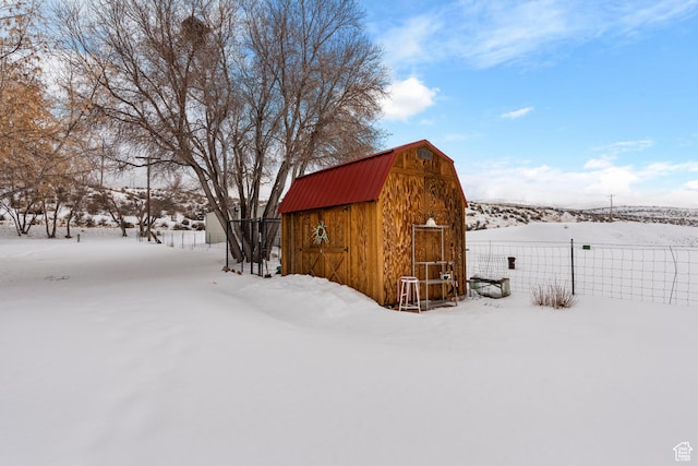 377 E Shore Rd, Saint Charles, ID 83272 - snow covered structure with an outdoor structure and fence
