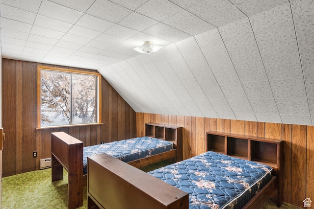 377 E Shore Rd, Saint Charles, ID 83272 - bedroom featuring a baseboard radiator, carpet, wooden walls, and vaulted ceiling