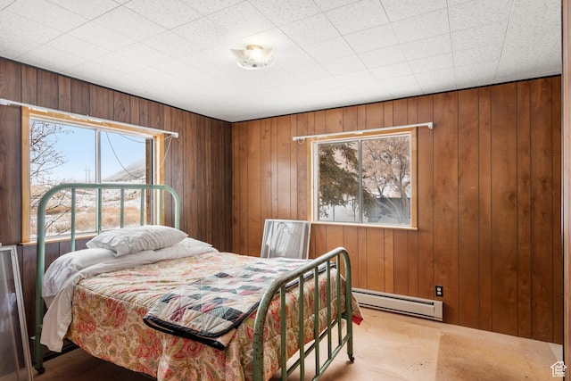 377 E Shore Rd, Saint Charles, ID 83272 - bedroom with baseboard heating and wood walls