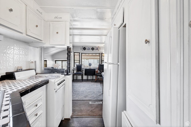 1225 N Dixie Downs Rd Unit 29, St George, UT 84770 - kitchen with white cabinetry, tile counters, and white appliances
