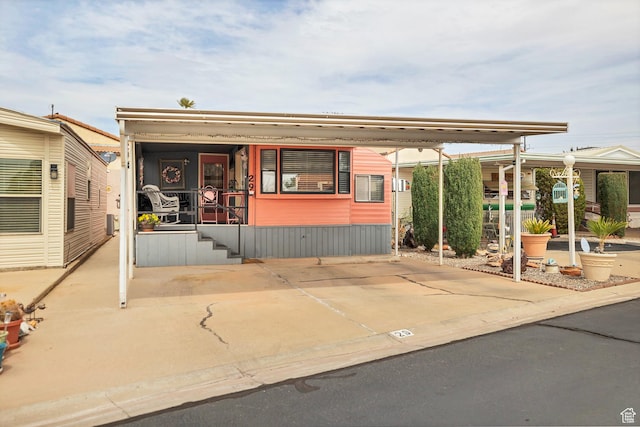 1225 N Dixie Downs Rd Unit 29, St George, UT 84770 - manufactured / mobile home featuring a carport and a porch