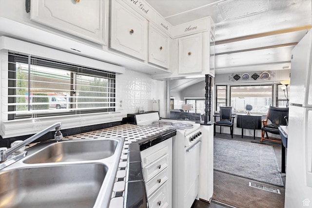 1225 N Dixie Downs Rd Unit 29, St George, UT 84770 - kitchen featuring white cabinetry, tile counters, white range with electric cooktop, a sink, and visible vents