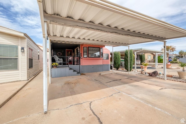 1225 N Dixie Downs Rd Unit 29, St George, UT 84770 - view of patio featuring driveway and a carport