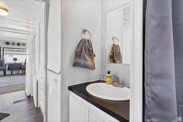 1225 N Dixie Downs Rd Unit 29, St George, UT 84770 - bathroom featuring visible vents, wood finished floors, and vanity