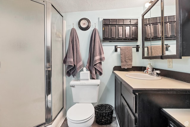 1225 N Dixie Downs Rd Unit 29, St George, UT 84770 - full bathroom featuring a textured ceiling, toilet, vanity, and a shower stall