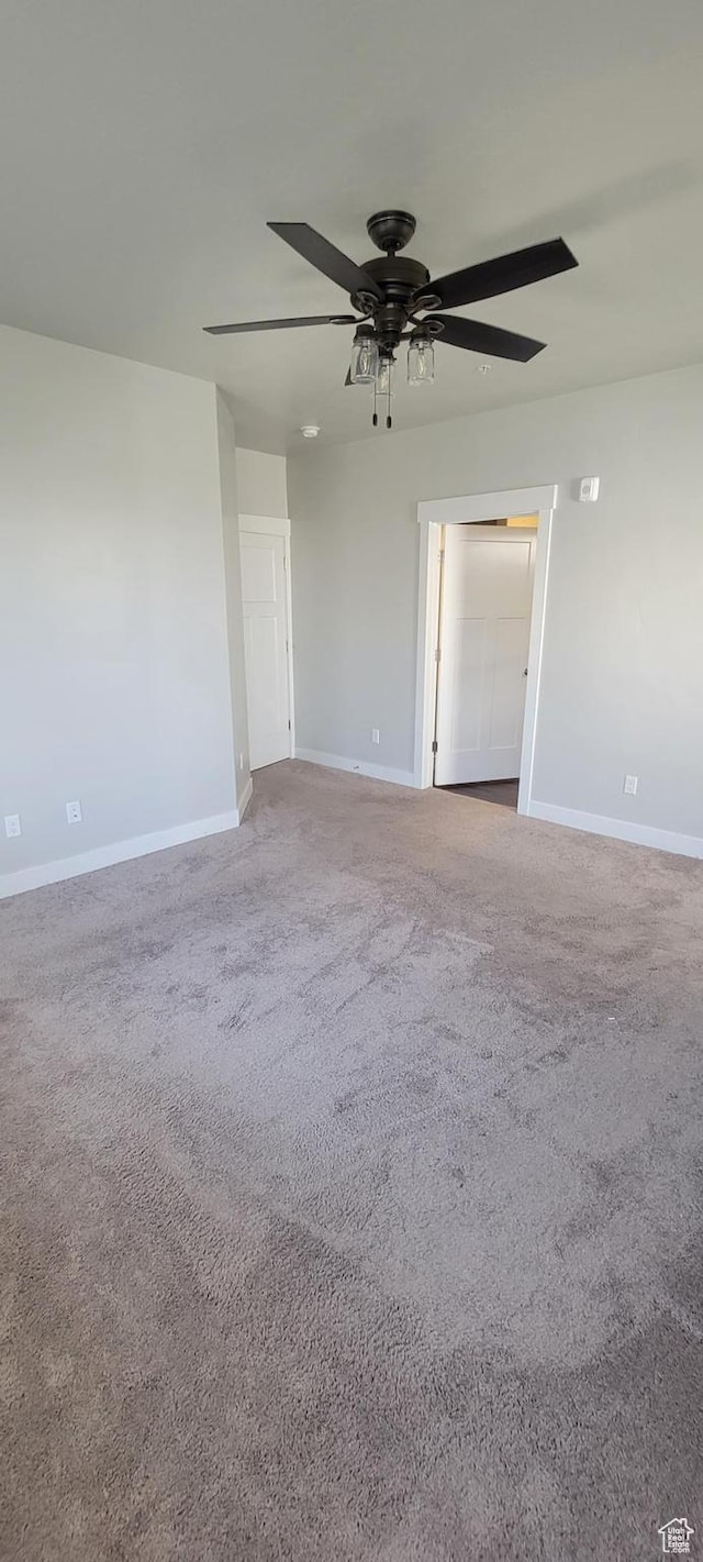 13091 S Newbridge Ln Unit F202, Herriman, UT 84096 - carpeted empty room with a ceiling fan and baseboards