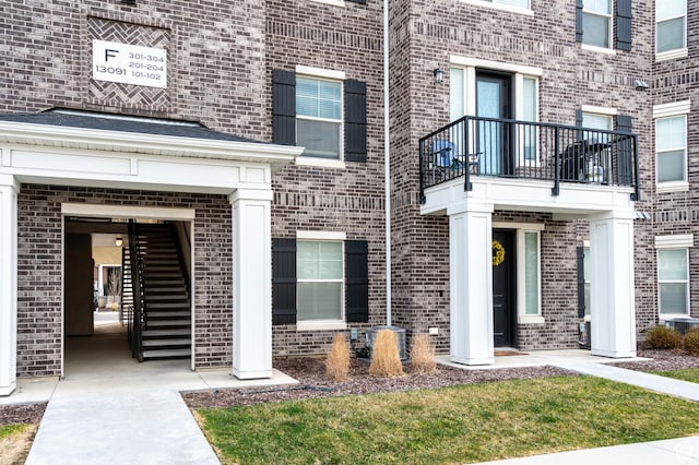 13091 S Newbridge Ln Unit F202, Herriman, UT 84096 - view of exterior entry with brick siding
