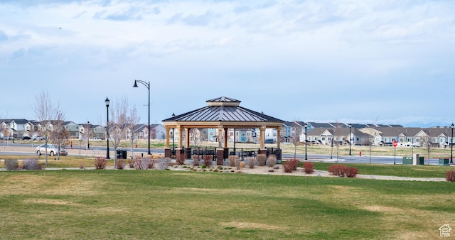 13091 S Newbridge Ln Unit F202, Herriman, UT 84096 - view of property's community featuring a lawn, a gazebo, and a residential view