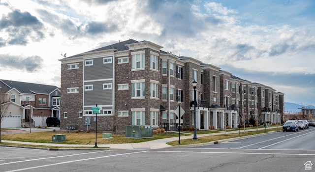 13091 S Newbridge Ln Unit F202, Herriman, UT 84096 - view of building exterior featuring a residential view