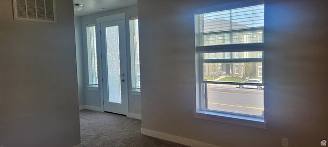 13091 S Newbridge Ln Unit F202, Herriman, UT 84096 - entryway featuring baseboards, carpet floors, and visible vents