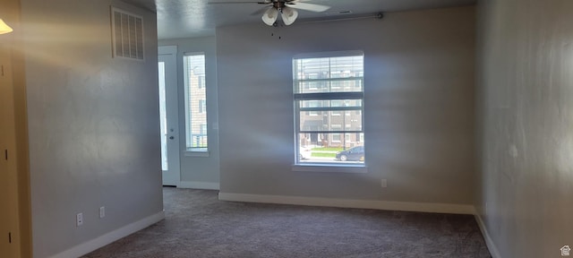 13091 S Newbridge Ln Unit F202, Herriman, UT 84096 - carpeted empty room featuring a wealth of natural light, visible vents, baseboards, and a ceiling fan