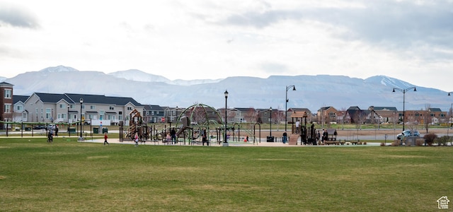 13091 S Newbridge Ln Unit F202, Herriman, UT 84096 - view of property's community with a residential view, a mountain view, and a lawn