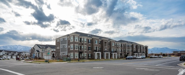 13091 S Newbridge Ln Unit F202, Herriman, UT 84096 - view of building exterior with a mountain view