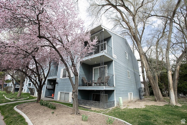 3510 S 300 E Unit E, South Salt Lake, UT 84115 - rear view of property with a balcony