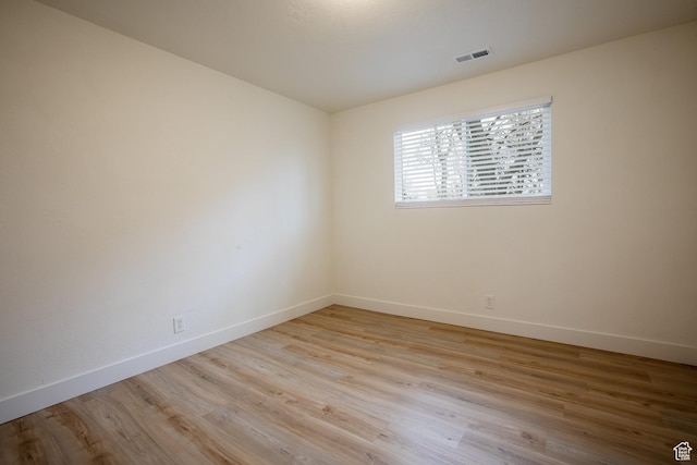 3510 S 300 E Unit E, South Salt Lake, UT 84115 - spare room featuring baseboards and light wood finished floors