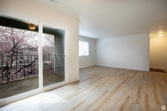 3510 S 300 E Unit E, South Salt Lake, UT 84115 - spare room featuring crown molding, wood finished floors, and baseboards