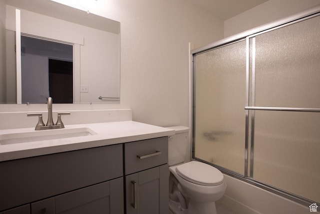 3510 S 300 E Unit E, South Salt Lake, UT 84115 - bathroom featuring toilet, vanity, and combined bath / shower with glass door