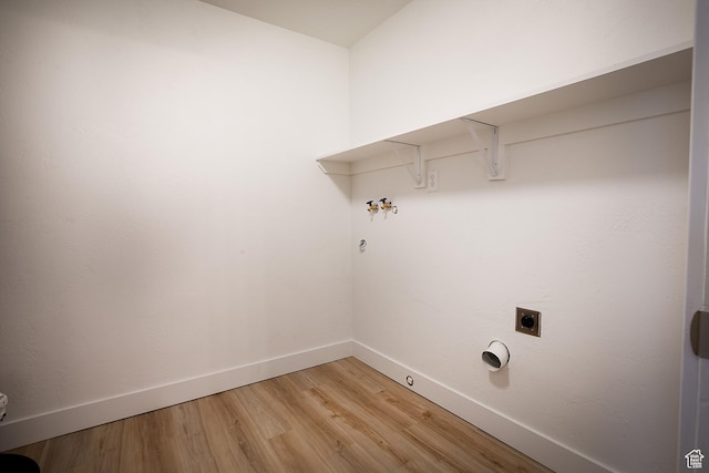 3510 S 300 E Unit E, South Salt Lake, UT 84115 - laundry area with baseboards, light wood finished floors, gas dryer hookup, hookup for a washing machine, and hookup for an electric dryer