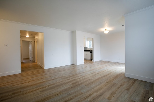 3510 S 300 E Unit E, South Salt Lake, UT 84115 - unfurnished room featuring light wood-type flooring, baseboards, and ornamental molding