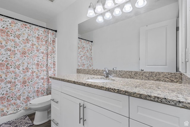 3414 S Melanie Cv W Unit 13, Magna, UT 84044 - bathroom with toilet, a shower with shower curtain, vanity, and wood finished floors