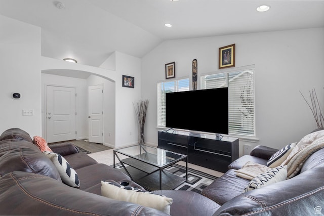 3414 S Melanie Cv W Unit 13, Magna, UT 84044 - living room featuring baseboards, wood finished floors, recessed lighting, arched walkways, and lofted ceiling
