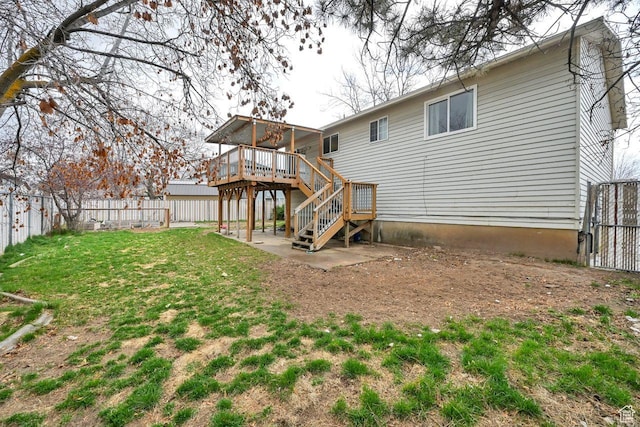 back of property featuring a patio, stairs, a fenced backyard, a deck, and a yard