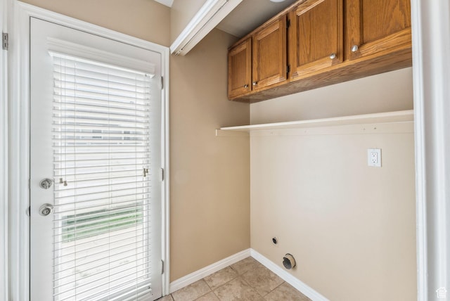 499 N 200 W Unit 8, Bountiful, UT 84010 - laundry area featuring baseboards, cabinet space, and light tile patterned floors