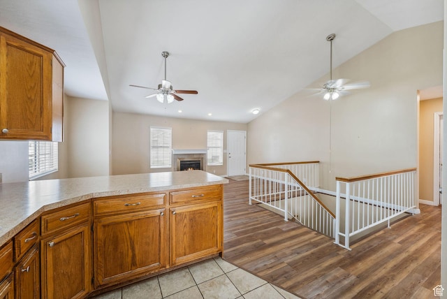 499 N 200 W Unit 8, Bountiful, UT 84010 - kitchen featuring ceiling fan, brown cabinetry, and a peninsula
