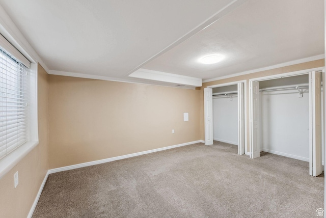 499 N 200 W Unit 8, Bountiful, UT 84010 - unfurnished bedroom with two closets, carpet, multiple windows, and baseboards