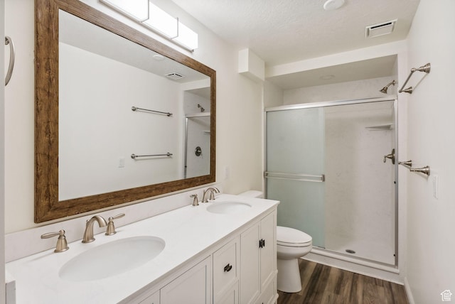 499 N 200 W Unit 8, Bountiful, UT 84010 - bathroom with a shower stall, visible vents, wood finished floors, and a sink
