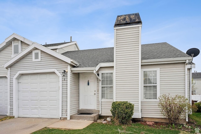 499 N 200 W Unit 8, Bountiful, UT 84010 - view of front of property featuring driveway, an attached garage, and roof with shingles