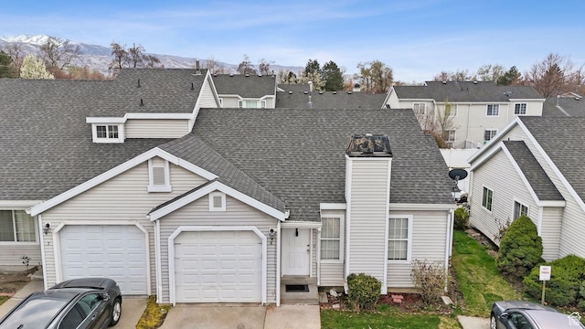 499 N 200 W Unit 8, Bountiful, UT 84010 - view of front facade featuring a garage, concrete driveway, a mountain view, and roof with shingles