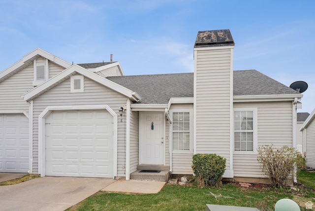 499 N 200 W Unit 8, Bountiful, UT 84010 - view of front of home featuring concrete driveway, a garage, and a shingled roof