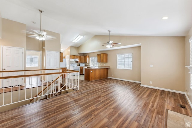 499 N 200 W Unit 8, Bountiful, UT 84010 - kitchen featuring wood finished floors, brown cabinets, under cabinet range hood, white appliances, and ceiling fan