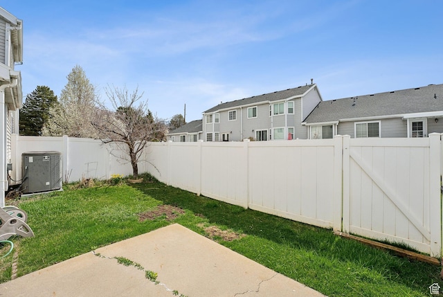 499 N 200 W Unit 8, Bountiful, UT 84010 - view of yard with a patio, central air condition unit, a fenced backyard, and a residential view