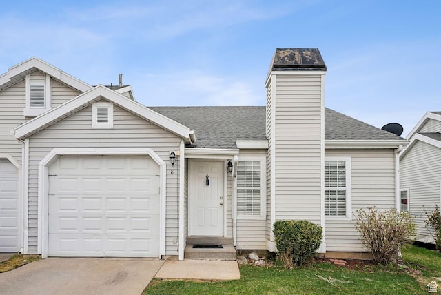 view of front facade featuring concrete driveway, an attached garage, and roof with shingles