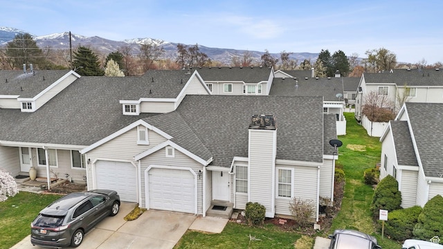 499 N 200 W Unit 8, Bountiful, UT 84010 - view of front of house with driveway, an attached garage, a residential view, a shingled roof, and a mountain view