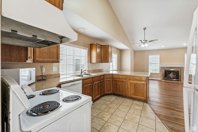 499 N 200 W Unit 8, Bountiful, UT 84010 - kitchen with white appliances, under cabinet range hood, a sink, ceiling fan, and brown cabinetry