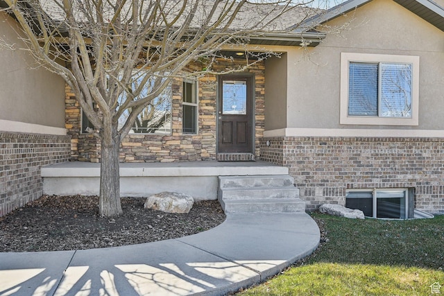 664 E Oak Wood Dr N Unit 50, Heber City, UT 84032 - view of exterior entry featuring stucco siding and stone siding