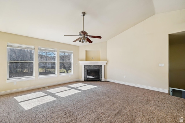 664 E Oak Wood Dr N Unit 50, Heber City, UT 84032 - unfurnished living room featuring a ceiling fan, vaulted ceiling, a glass covered fireplace, carpet flooring, and baseboards