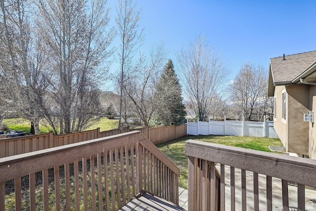 664 E Oak Wood Dr N Unit 50, Heber City, UT 84032 - deck with a fenced backyard and a lawn
