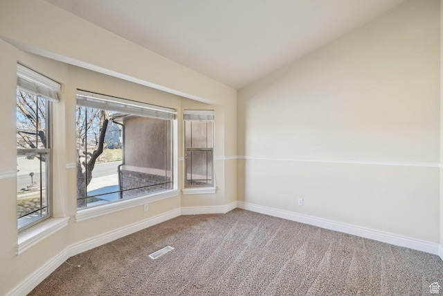 664 E Oak Wood Dr N Unit 50, Heber City, UT 84032 - carpeted spare room featuring visible vents, baseboards, vaulted ceiling, and a healthy amount of sunlight